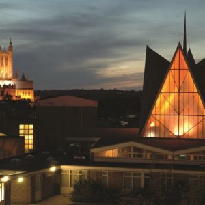 Canterbury Campus by night - the Chapel with Canterbury Cathedral in the distance.