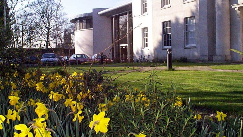 View across the front of Old Sessions House in the Spring.